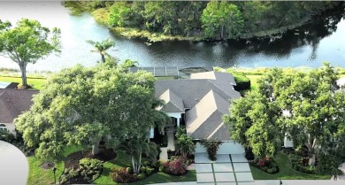 Reminiscent of On Golden Pond, this waterfront sanctuary will on TPC Prestancia in Florida - for sale on GolfHomes.com, golf home, golf lot