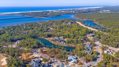 Serene wooded lot with pond in rear. Price includes ARB approved on Sharks Tooth Golf Club in Florida - for sale on GolfHomes.com, golf home, golf lot