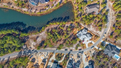 Serene wooded lot with pond in rear. Price includes ARB approved on Sharks Tooth Golf Club in Florida - for sale on GolfHomes.com, golf home, golf lot