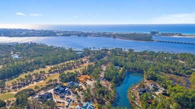 Serene wooded lot with pond in rear. Price includes ARB approved on Sharks Tooth Golf Club in Florida - for sale on GolfHomes.com, golf home, golf lot