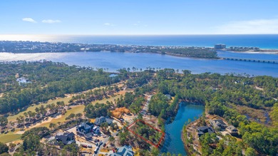 Serene wooded lot with pond in rear. Price includes ARB approved on Sharks Tooth Golf Club in Florida - for sale on GolfHomes.com, golf home, golf lot