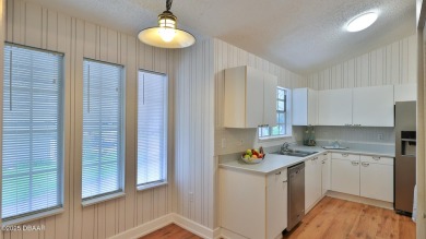 Step out your door with your golf clubs in hand!  The perfect on Daytona Beach Golf Club in Florida - for sale on GolfHomes.com, golf home, golf lot