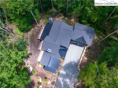 This custom built exquisite mountain modern home is one of a on Elk River Club in North Carolina - for sale on GolfHomes.com, golf home, golf lot