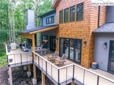 This custom built exquisite mountain modern home is one of a on Elk River Club in North Carolina - for sale on GolfHomes.com, golf home, golf lot