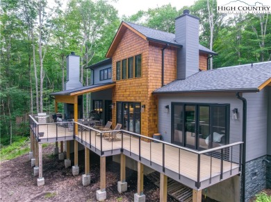 This custom built exquisite mountain modern home is one of a on Elk River Club in North Carolina - for sale on GolfHomes.com, golf home, golf lot