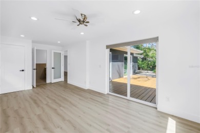 5-bedroom, 3-bathroom Mid-Century home in desirable Dunedin on The Dunedin Country Club in Florida - for sale on GolfHomes.com, golf home, golf lot