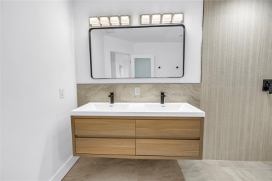 5-bedroom, 3-bathroom Mid-Century home in desirable Dunedin on The Dunedin Country Club in Florida - for sale on GolfHomes.com, golf home, golf lot