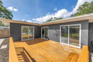 5-bedroom, 3-bathroom Mid-Century home in desirable Dunedin on The Dunedin Country Club in Florida - for sale on GolfHomes.com, golf home, golf lot