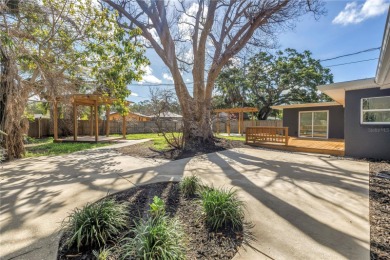 5-bedroom, 3-bathroom Mid-Century home in desirable Dunedin on The Dunedin Country Club in Florida - for sale on GolfHomes.com, golf home, golf lot