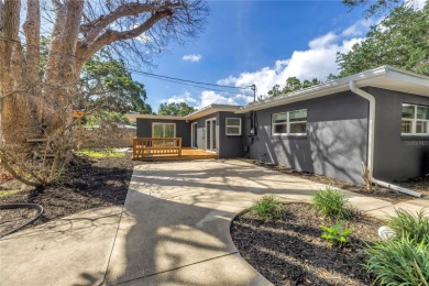 5-bedroom, 3-bathroom Mid-Century home in desirable Dunedin on The Dunedin Country Club in Florida - for sale on GolfHomes.com, golf home, golf lot