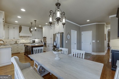 Nestled within the prestigious Chattahoochee River Club, this on Sugar Hill Golf Club in Georgia - for sale on GolfHomes.com, golf home, golf lot