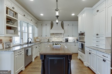 Nestled within the prestigious Chattahoochee River Club, this on Sugar Hill Golf Club in Georgia - for sale on GolfHomes.com, golf home, golf lot