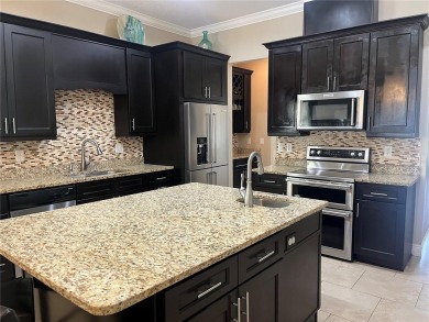 PRICE JUST REDUCED! Welcome to an impeccably maintained modern on Babe Zaharias Golf Course in Florida - for sale on GolfHomes.com, golf home, golf lot