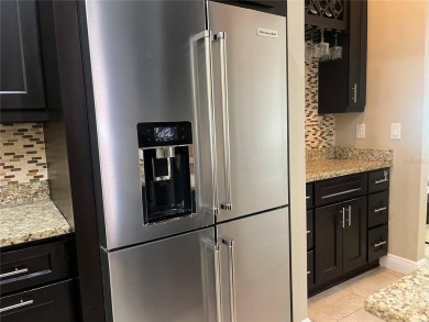 PRICE JUST REDUCED! Welcome to an impeccably maintained modern on Babe Zaharias Golf Course in Florida - for sale on GolfHomes.com, golf home, golf lot