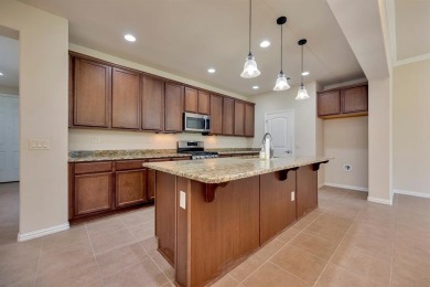 This beautifully maintained corner lot half duplex home is on Wildhorse Golf Club of Robson Ranch in Texas - for sale on GolfHomes.com, golf home, golf lot