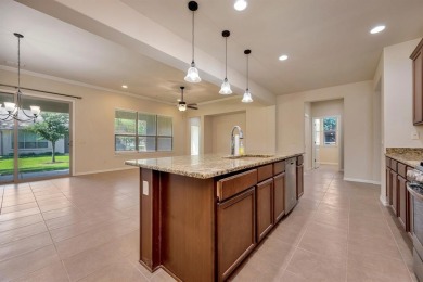 This beautifully maintained corner lot half duplex home is on Wildhorse Golf Club of Robson Ranch in Texas - for sale on GolfHomes.com, golf home, golf lot