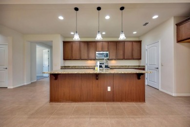 This beautifully maintained corner lot half duplex home is on Wildhorse Golf Club of Robson Ranch in Texas - for sale on GolfHomes.com, golf home, golf lot