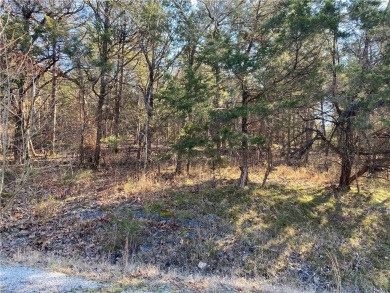 A perfect slightly uphill lot on a quiet street that is just a on Holiday Island Executive Golf Course in Arkansas - for sale on GolfHomes.com, golf home, golf lot