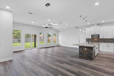 Step inside this 4 bedroom, 2 bath, with an office/flex room on Pine Forest Golf Club in Texas - for sale on GolfHomes.com, golf home, golf lot