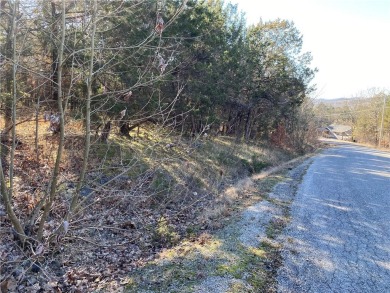 A perfect slightly uphill lot on a quiet street that is just a on Holiday Island Executive Golf Course in Arkansas - for sale on GolfHomes.com, golf home, golf lot
