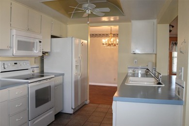 This single-family home located in Unit 2 of Mainlands by the on Mainlands Golf Club in Florida - for sale on GolfHomes.com, golf home, golf lot