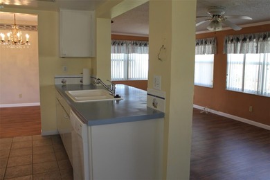 This single-family home located in Unit 2 of Mainlands by the on Mainlands Golf Club in Florida - for sale on GolfHomes.com, golf home, golf lot