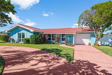 Experience the perfect blend of coastal charm and modern comfort on Gulf Harbors Golf Course in Florida - for sale on GolfHomes.com, golf home, golf lot