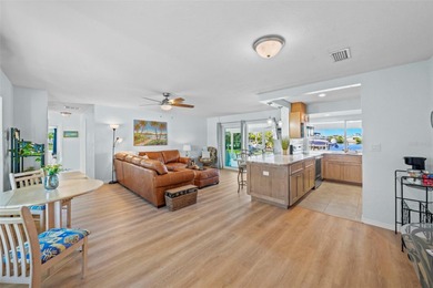 Experience the perfect blend of coastal charm and modern comfort on Gulf Harbors Golf Course in Florida - for sale on GolfHomes.com, golf home, golf lot
