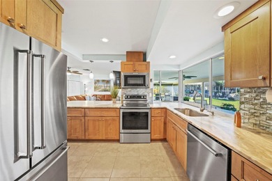 Experience the perfect blend of coastal charm and modern comfort on Gulf Harbors Golf Course in Florida - for sale on GolfHomes.com, golf home, golf lot