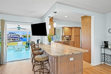 Experience the perfect blend of coastal charm and modern comfort on Gulf Harbors Golf Course in Florida - for sale on GolfHomes.com, golf home, golf lot