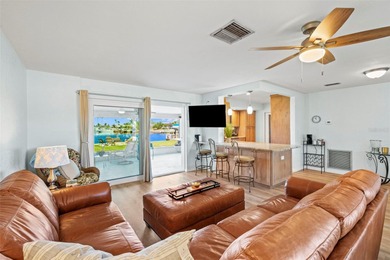 Experience the perfect blend of coastal charm and modern comfort on Gulf Harbors Golf Course in Florida - for sale on GolfHomes.com, golf home, golf lot