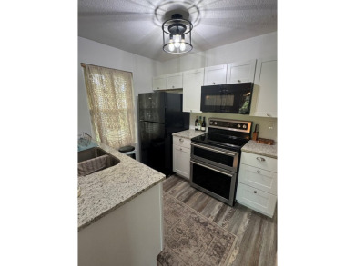 Highly sought after ground floor corner end unit overlooking the on Rockport Country Club in Texas - for sale on GolfHomes.com, golf home, golf lot