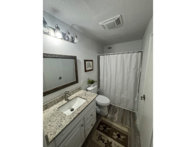 Highly sought after ground floor corner end unit overlooking the on Rockport Country Club in Texas - for sale on GolfHomes.com, golf home, golf lot
