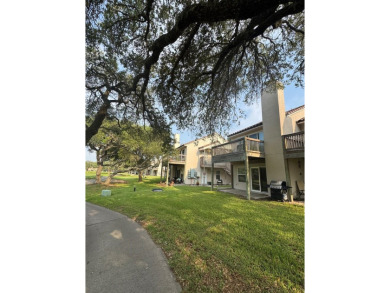 Highly sought after ground floor corner end unit overlooking the on Rockport Country Club in Texas - for sale on GolfHomes.com, golf home, golf lot