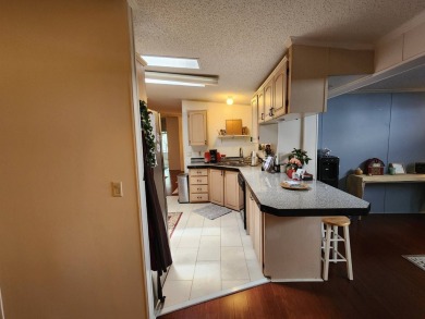 Welcome to this lovely 3BR/2BA located in the 55+ active adult on Spanish Lakes Fairways in Florida - for sale on GolfHomes.com, golf home, golf lot