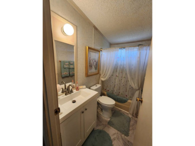 Welcome to this lovely 3BR/2BA located in the 55+ active adult on Spanish Lakes Fairways in Florida - for sale on GolfHomes.com, golf home, golf lot