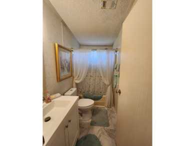 Welcome to this lovely 3BR/2BA located in the 55+ active adult on Spanish Lakes Fairways in Florida - for sale on GolfHomes.com, golf home, golf lot
