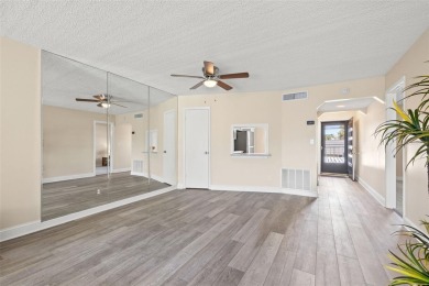 Beautifully Updated 2-Bedroom, 2-Bath End Unit in Cordova Greens on Bayou Golf Club in Florida - for sale on GolfHomes.com, golf home, golf lot