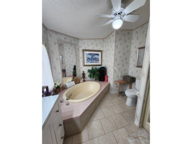 Welcome to this lovely 3BR/2BA located in the 55+ active adult on Spanish Lakes Fairways in Florida - for sale on GolfHomes.com, golf home, golf lot