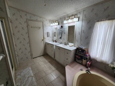 Welcome to this lovely 3BR/2BA located in the 55+ active adult on Spanish Lakes Fairways in Florida - for sale on GolfHomes.com, golf home, golf lot