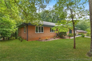 Welcome to a beautifully, partially updated brick home nestled on Carolina Trace Country Club in North Carolina - for sale on GolfHomes.com, golf home, golf lot