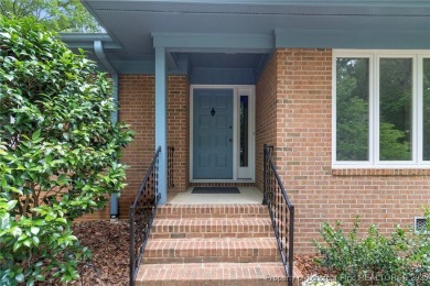 Welcome to a beautifully, partially updated brick home nestled on Carolina Trace Country Club in North Carolina - for sale on GolfHomes.com, golf home, golf lot