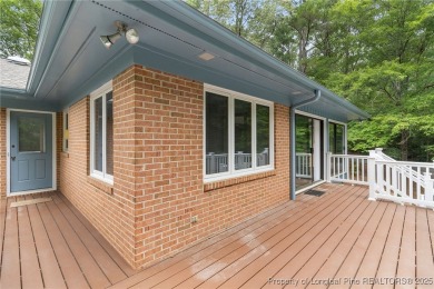 Welcome to a beautifully, partially updated brick home nestled on Carolina Trace Country Club in North Carolina - for sale on GolfHomes.com, golf home, golf lot
