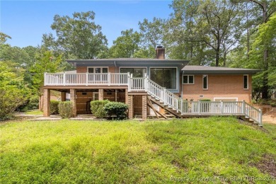 Welcome to a beautifully, partially updated brick home nestled on Carolina Trace Country Club in North Carolina - for sale on GolfHomes.com, golf home, golf lot