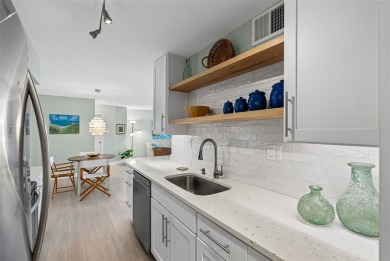 Welcome to LIVING LARGE in PARADISE!! This beautiful CORNER UNIT on Treasure Bay Golf and Tennis in Florida - for sale on GolfHomes.com, golf home, golf lot