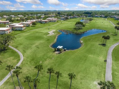 This charming partially furnished 2BR/2BA condo in Vista Royale on The American Golf Club in Florida - for sale on GolfHomes.com, golf home, golf lot