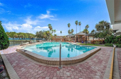 Welcome to LIVING LARGE in PARADISE!! This beautiful CORNER UNIT on Treasure Bay Golf and Tennis in Florida - for sale on GolfHomes.com, golf home, golf lot