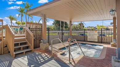 Welcome to LIVING LARGE in PARADISE!! This beautiful CORNER UNIT on Treasure Bay Golf and Tennis in Florida - for sale on GolfHomes.com, golf home, golf lot