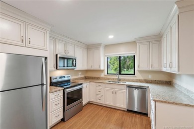 Welcome to this lovely villa set on a peaceful lake in the on Martin Downs Country Club in Florida - for sale on GolfHomes.com, golf home, golf lot