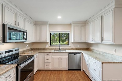 Welcome to this lovely villa set on a peaceful lake in the on Martin Downs Country Club in Florida - for sale on GolfHomes.com, golf home, golf lot